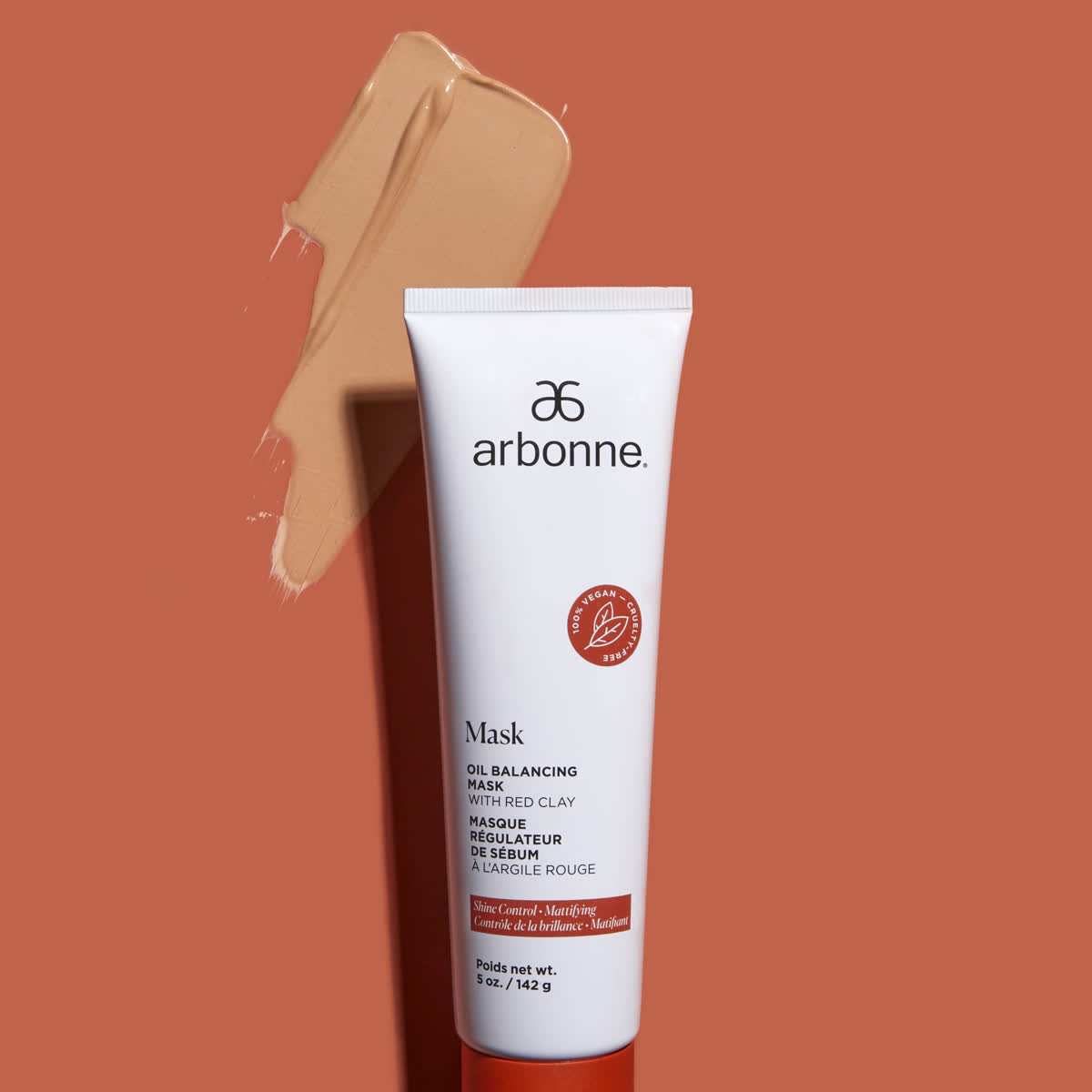 Arbonne oil balancing clay mask on terracotta with a swipe of product